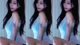 A cute Chinese girl with big tits dances seductively here.