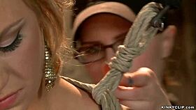 the oiled BLONDE gets BOUND HOGTIED and TORMENTED in intense session