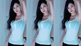 A cute Chinese girl with big tits dances seductively here.