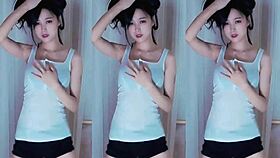 A cute Chinese girl with big tits dances seductively here.