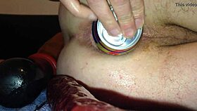 Beer bottle plunges into tight dildo assfucking