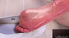A man lotions japanese woman's soles, drawing out her erotic moans in foot fetish bliss