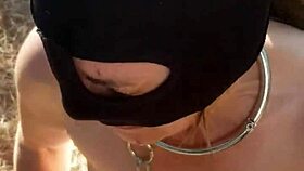 bound slave dressed for outdoor training and hardcore exhib