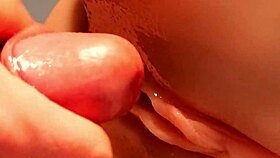 Man rear-enters shaved pussy close up with hard cock thrusts