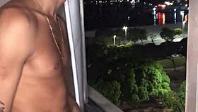 Safado boy jerks huge load handjob style at building window view