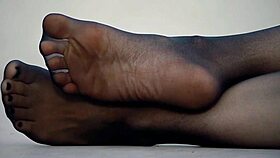 her sexy feet shimmer in nylon pantyhose craving your fetish worship now