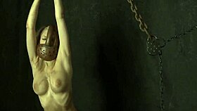 Chained cute shaved pussy babe masturbates boobs in BDSM cosplay fantasy.