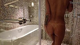 Stunning blonde milf Monika Fox strips naked for steamy shower tease