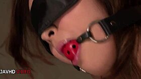 Exhausted Asian teen rests after intense session and bondage play