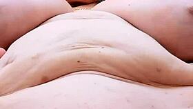 busty mature in lingerie teases her shaved pussy close up