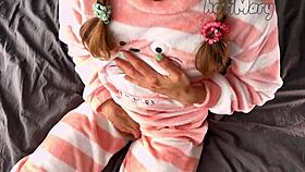 a petite 18+ babe in pajamas rubs her small tits and shaved pussy to wet orgasm