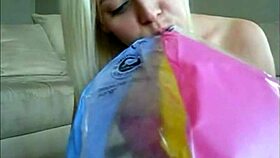 Sophie teases in jeans miniskirt and red lingerie before fingering her wet pussy on webcam