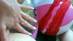 Sophie teases in jeans miniskirt and red lingerie before fingering her wet pussy on webcam