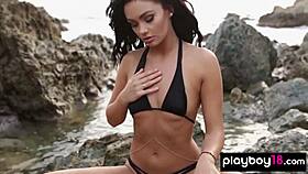 skinny kristie taylor strips bikini spreads legs beach rocks