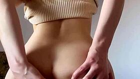 Watch this tiny teen rub her shaved pussy to orgasm