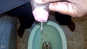 black dude lets loose pissing stream casually