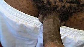 Hairy neighbor guy strokes his big black cock indoors casually