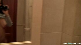 Solo busty babe fingers hairy bush in bathroom