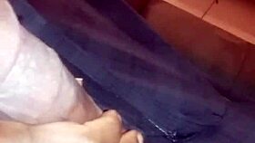 Ebony babe gives nasty bbc handjob while watching movie