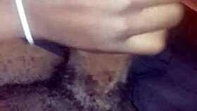 Ebony babe gives nasty bbc handjob while watching movie