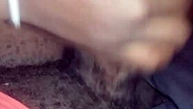 Ebony babe gives nasty bbc handjob while watching movie