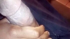 Ebony babe gives nasty bbc handjob while watching movie