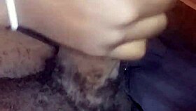 Ebony babe gives nasty bbc handjob while watching movie