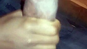 Ebony babe gives nasty bbc handjob while watching movie