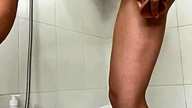 Hey, this babe masturbates in shower to wild climax