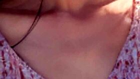 Mature model wanders the sunny beach in casual narrative stroll