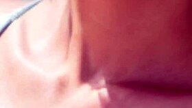 Mature model wanders the sunny beach in casual narrative stroll