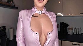 European German beauty poses naked in latex with pierced nipples and tattoos