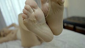 Sexy blonde milf in nylons teases feet toes for foot fetish cum domination lick