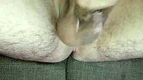 He strokes uncircumcised cock in bedroom solitude