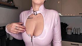 European German beauty poses naked in latex with pierced nipples and tattoos