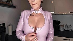 European German beauty poses naked in latex with pierced nipples and tattoos