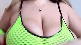 Curvy woman with natural breasts gently fondles herself