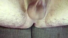 He strokes uncircumcised cock in bedroom solitude