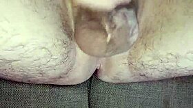 He strokes uncircumcised cock in bedroom solitude