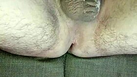 He strokes uncircumcised cock in bedroom solitude