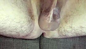 He strokes uncircumcised cock in bedroom solitude