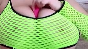 Curvy woman with natural breasts gently fondles herself