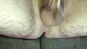 He strokes uncircumcised cock in bedroom solitude