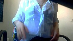 the hot secretary slips off her bra then fingers her bare pussy under miniskirt