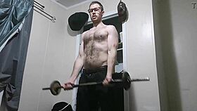 Muscular homemade stud pumps huge cock in intense doggystyle workout close-up.