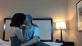 She shares a passionate kiss with the petite tattooed young woman nearby