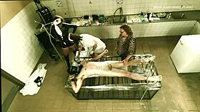 a dominatrix runs a harsh clinic for cock treatment.