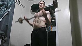 Muscular homemade stud pumps huge cock in intense doggystyle workout close-up.