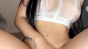 Colombian beauty teases pussy with favorite big dildo