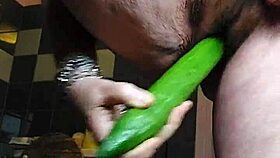 granny rams cucumber deep into hairy pussy